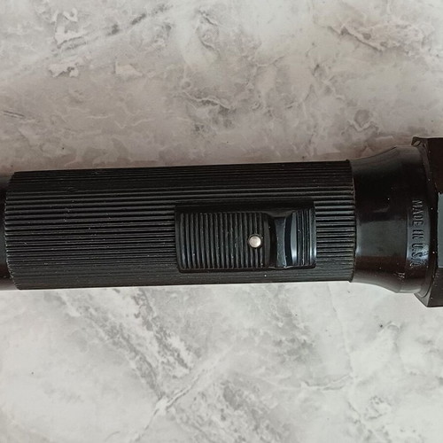 Plastic flashlight used, simple, works with 2 DD batteries