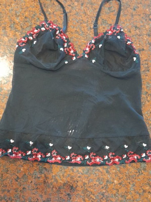 Top black lycra with embroidered designs like new