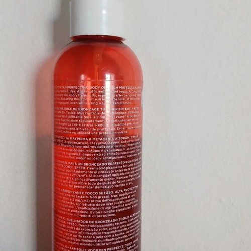 Apivita body tanning oil used with SPF30