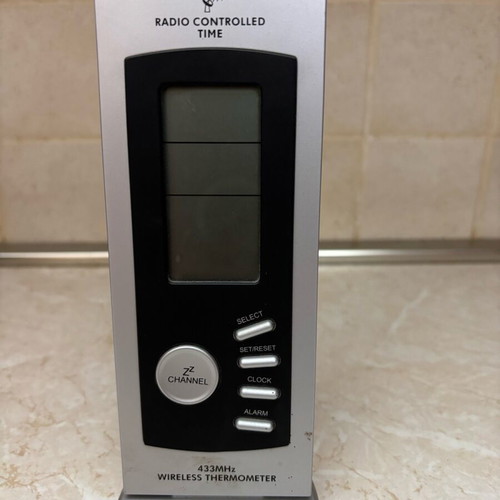Wireless digital weather station used with radio-controlled clock