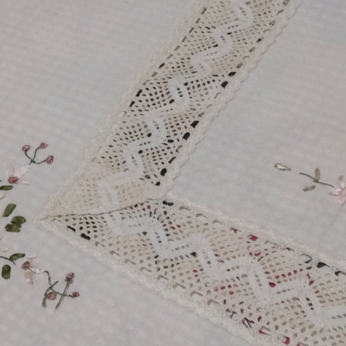 Embroidered tablecloth like new with satin ribbon and floral motifs