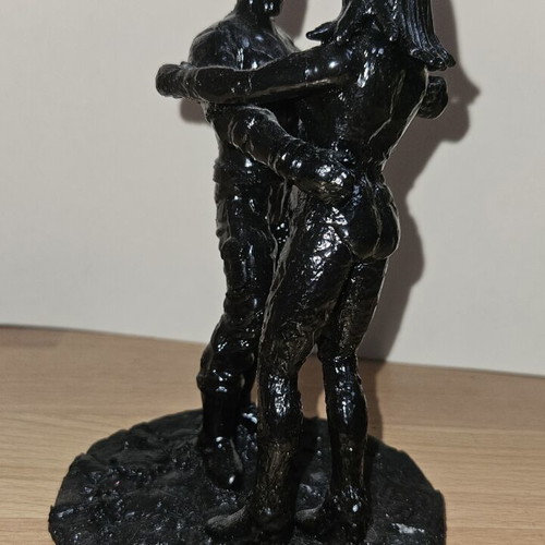 Handmade sculpture of embracing couple