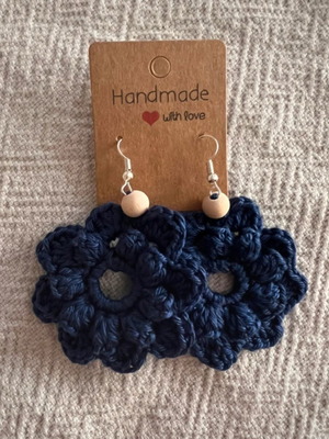 Handmade crochet flower-shaped earrings in navy blue