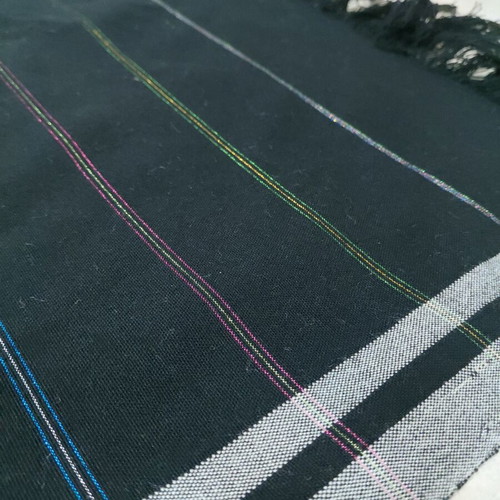 Traditional cotton fabric on loom, new, black with gray stripes and fringes
