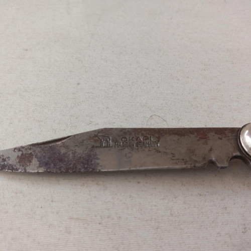 Okapi German pocket knife used with blade oxidation