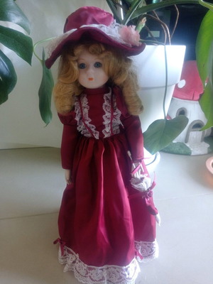 Vintage porcelain doll used in very good condition