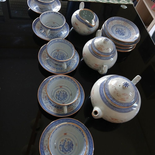 Tea set like new with teapot, creamer, sugar bowl, 5 cups and 10 saucers