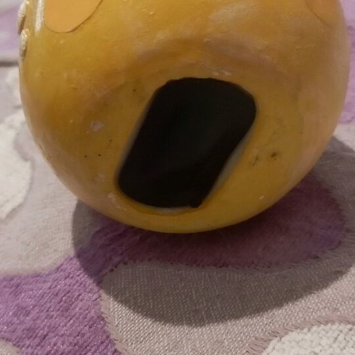 Ceramic piggy bank used with bottom opening