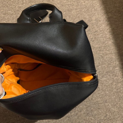 Leather backpack like new, black with orange lining