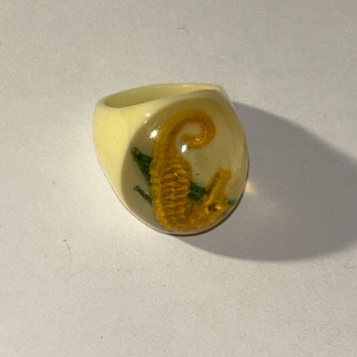 Vintage resin seahorse ring with off-white base, like new