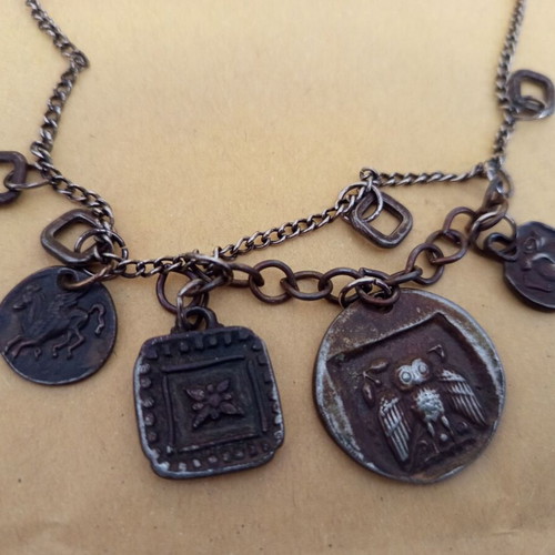 Antique pendant used with ancient Greek symbols