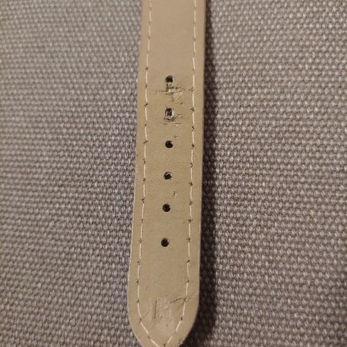 Quartz wristwatch used with crystals and leatherette strap