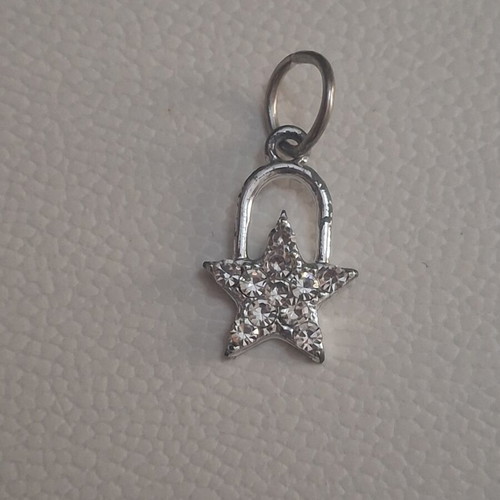 Charm star decorated with sparkling stones used, silver