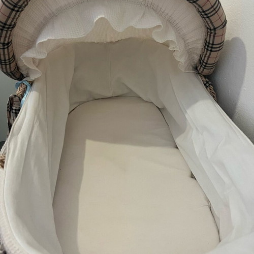 Wicker bassinet like new with base, wheels and cushion
