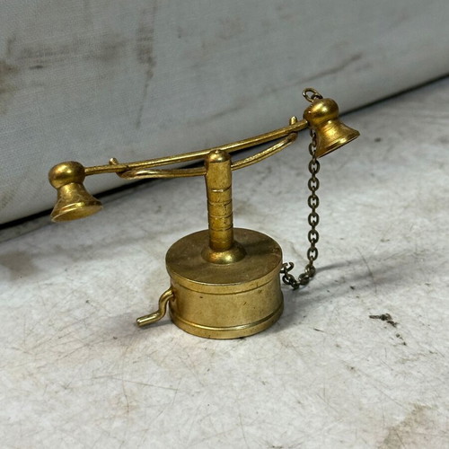 Brass miniature of old candlestick telephone, used