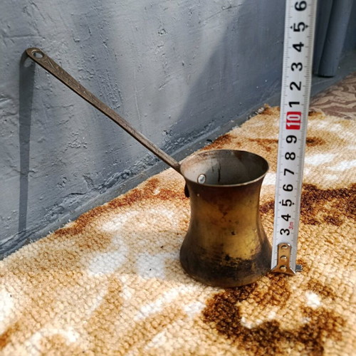 Old cezve handmade with engraved handle, used