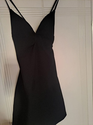Black mini dress tight with nice back like new