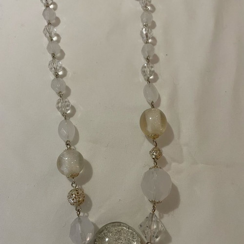 Vintage bead necklace used in clear, white, and silver tones