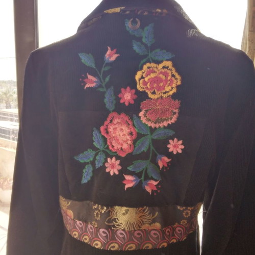 Black corduroy/velvet coat like new, size L/XL with colorful designs