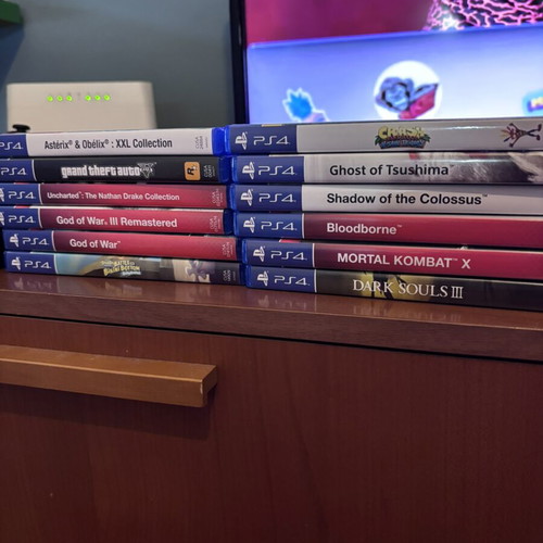 PlayStation 4 console with 16 games and two controllers