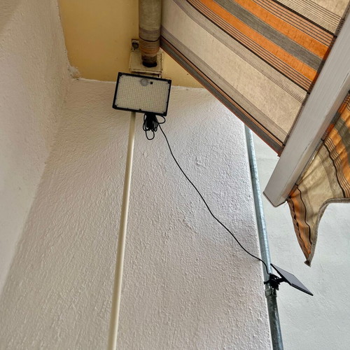 Solar LED Floodlight with Remote Control and Motion Sensor, New