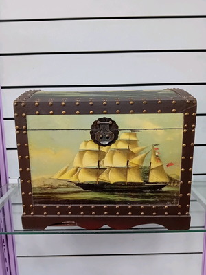 Large trunk used with ship decor and leather handles