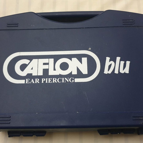 Caflon Blu ear piercing set new, complete