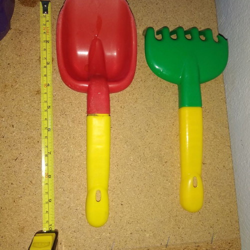 Sand bucket used with shovel, rake and 4 toy cars