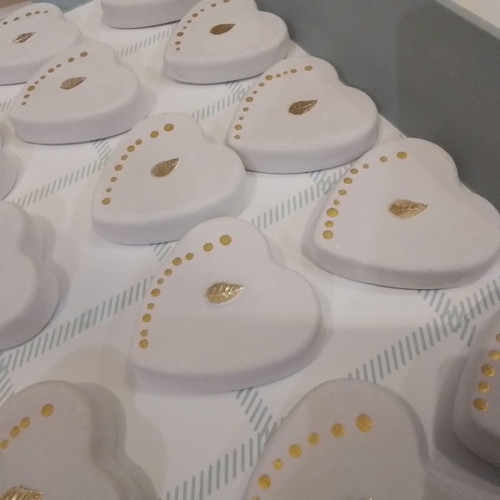 Wedding favors scented plaster hearts in organza pouch with glass bottles