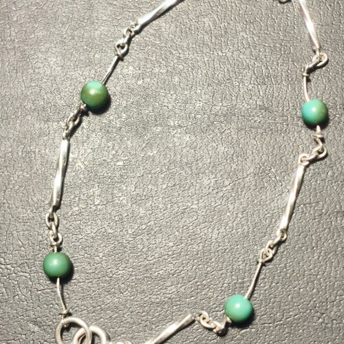 Silver bracelet with green beads used, needs repair