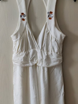 White blouse used with rhinestones and back opening size M