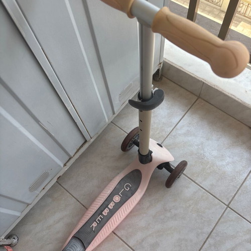 Pink children's scooter used with light-up wheels