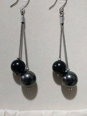 Earrings used, dangling with anthracite pearls
