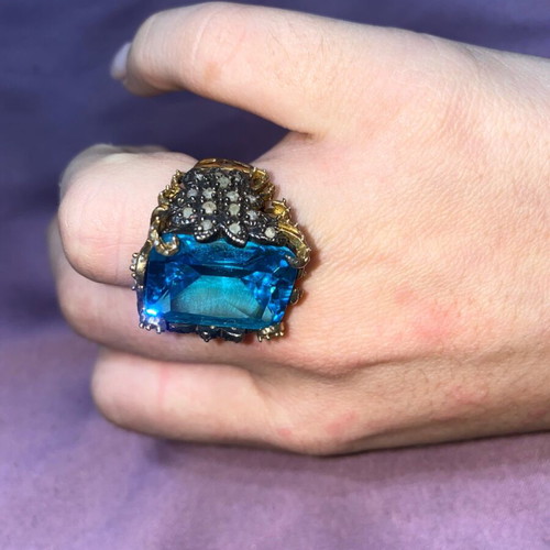 Silver ring plated with 9K gold, like new, blue topaz center