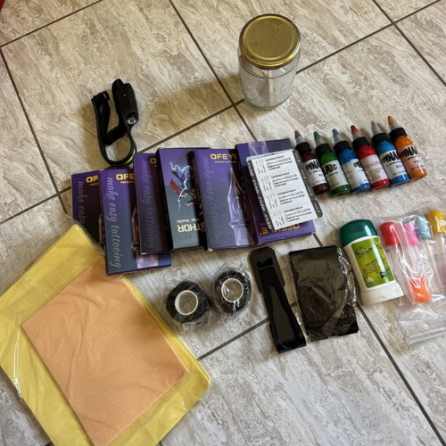 Tattoo supply kit with cartridges, inks, and accessories