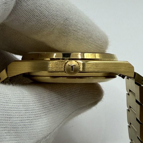 Tissot PRX Quartz watch with golden dial
