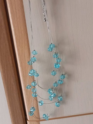 Blue necklace new with fishing line and blue stones