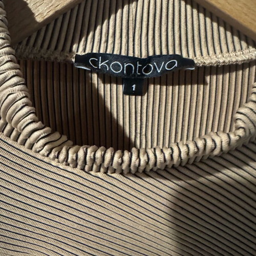 Ckontova beige bodysuit size S like new with chest opening