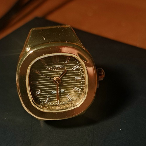 Ring watch with khaki dial and gold bracelet
