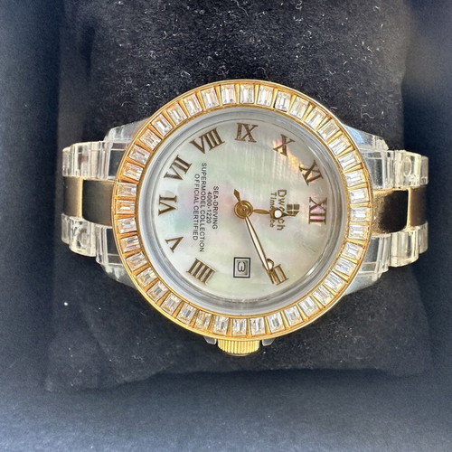 Watch with iridescent crystals like new, zircon and gold