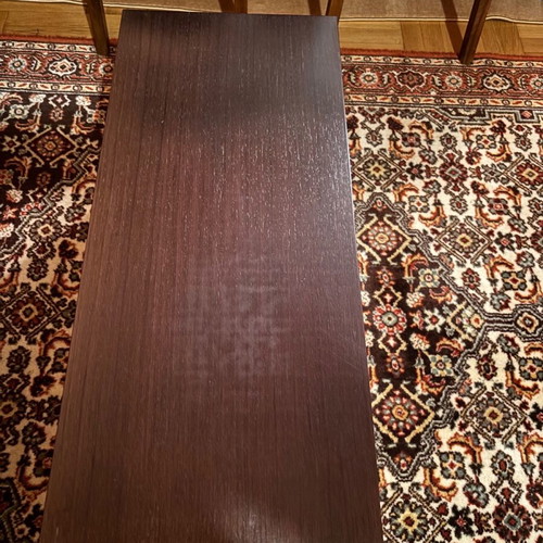 Coffee table used, rectangular wood with hidden wheels