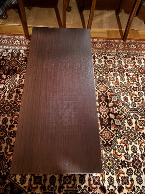 Coffee table used, rectangular wood with hidden wheels