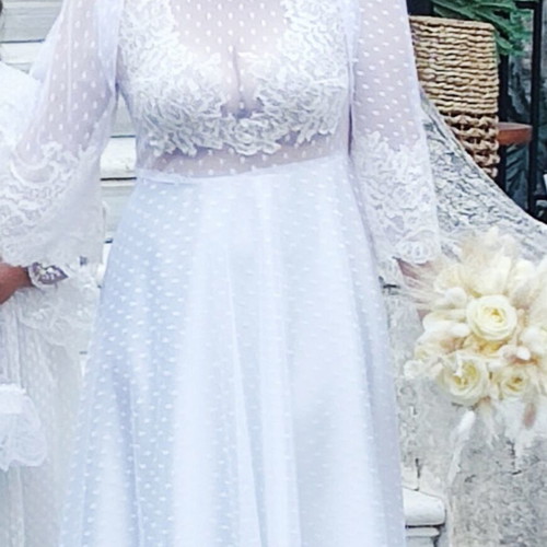 Romantic vintage-inspired wedding dress with polka dot tulle and lace
