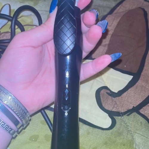 Hair curling iron used with some rust, functional