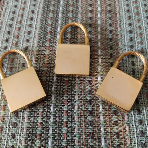 Keychains set of 3 used, gold tone, promotional children's clothing