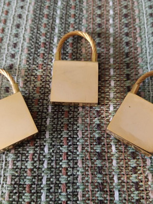 Keychains set of 3 used, gold tone, promotional children's clothing