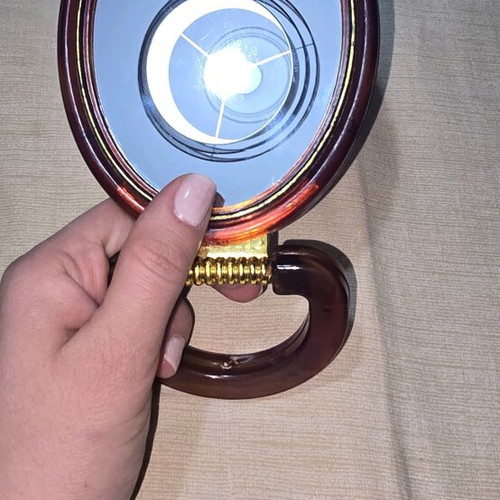 Hand mirror with two sides like new for magnification and reduction
