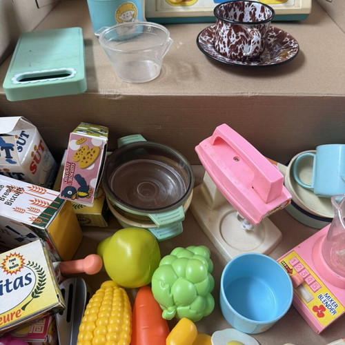 Kitchen playset like new with utensils, food packages, and vegetables