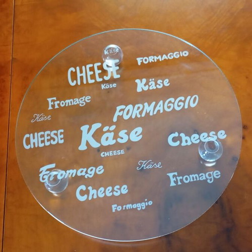 Glass cheese platter new with embossed design and three supports