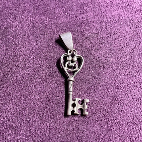 Silver pendant in key shape made of 800 silver